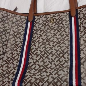 A tommy Hilfiger bag with TH all over.
